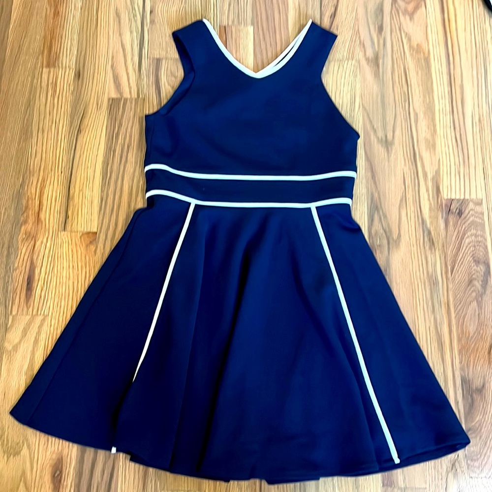 Cute and flowey size 10 in youth navy dress with white outline waistband